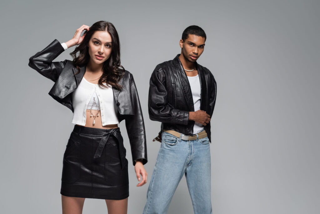 Stylish couple wearing faux leather jackets, demonstrating ethical fashion alternatives.