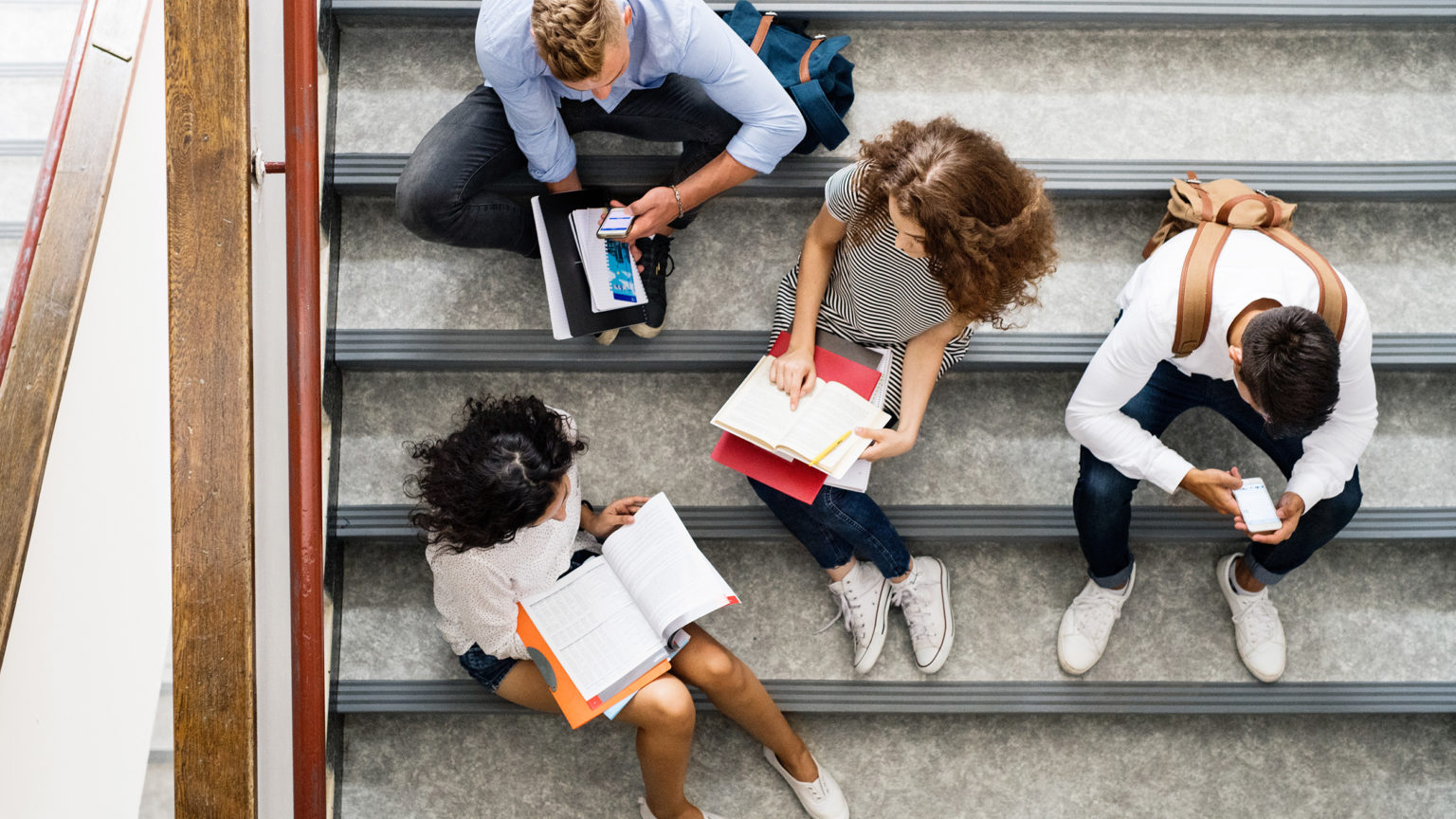 a group of people sitting on the stairs