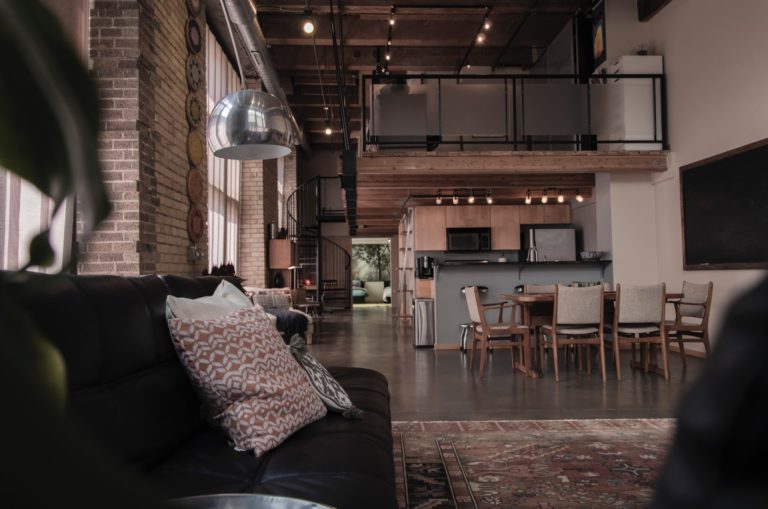 a living room with a couch and a fireplace