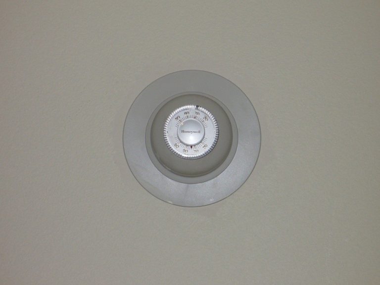 a white fan on a white wall