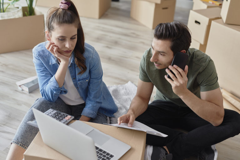 a woman and a man looking at a tablet