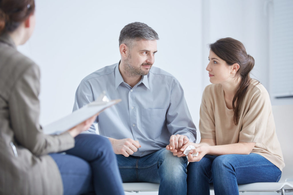 a group of people sitting in a circle