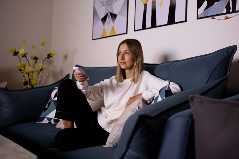 a woman sitting on a couch