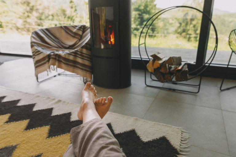 Woman barefoot relaxing in comfortable home