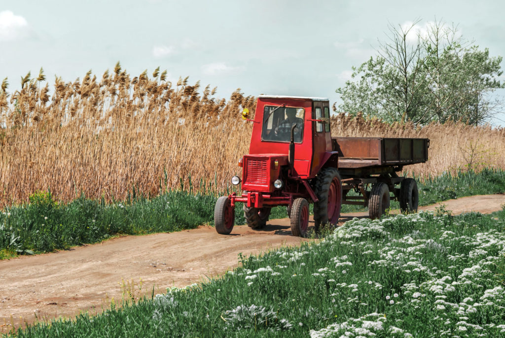 tractor trailer on a dirt road