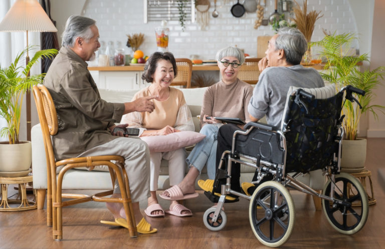 Group Asian seniors friends enjoying talking together.